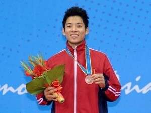 Vietnamese wushu artist Nguyen Manh Quyen on November 14 took home the first medal on the second day of the 16th Asian Games. (Photo:VNA) Vietnamese wushu artist Nguyen Manh Quyen on November 14 took home the first medal on the second day of the 16th Asian Games. (Photo:VNA)